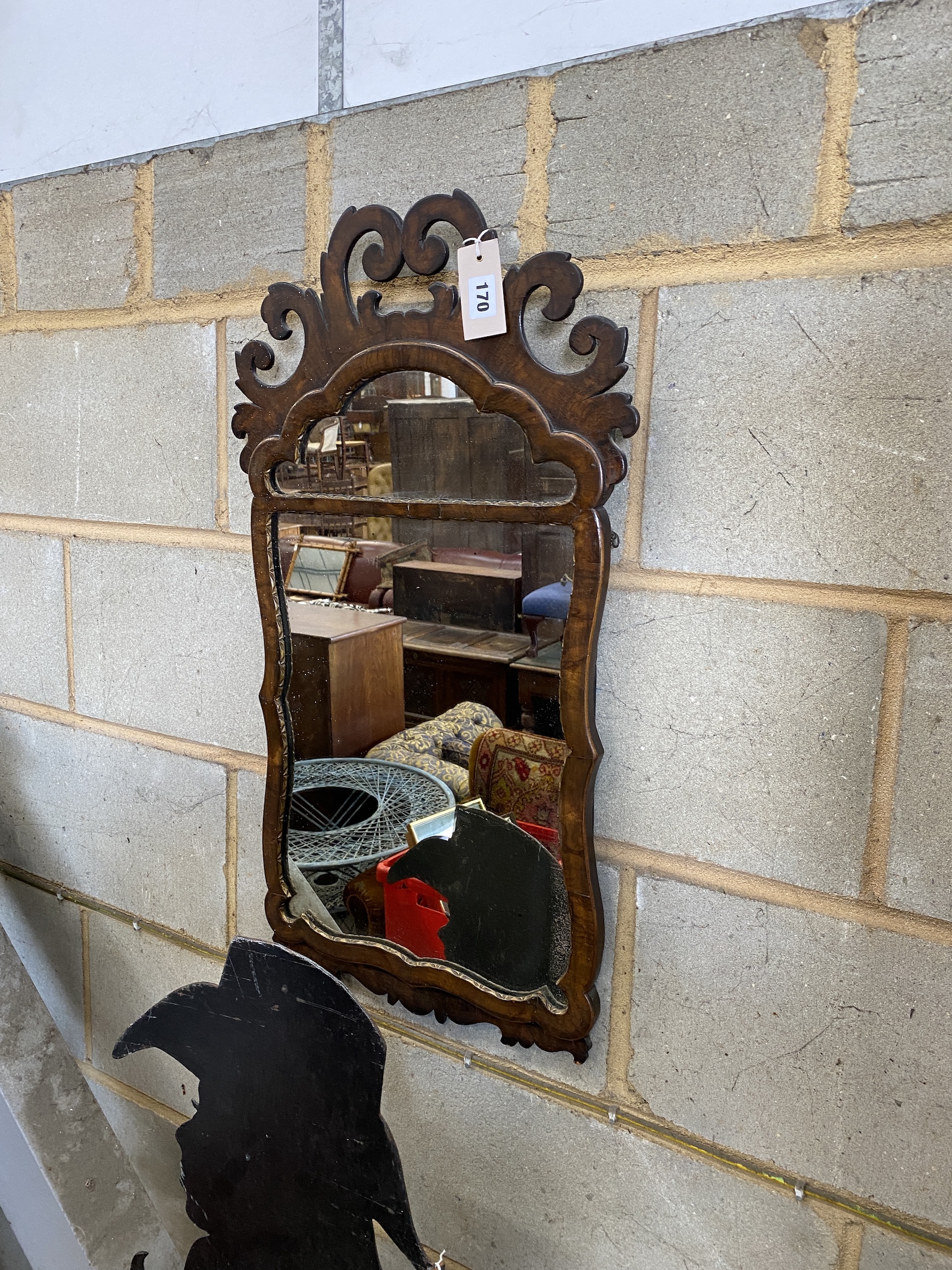 An 18th century style walnut and parcel gilt fret carved wall mirror, width 41cm, height 72cm, NB: From the Estate of Rt Hon Lord Lawson of Blaby